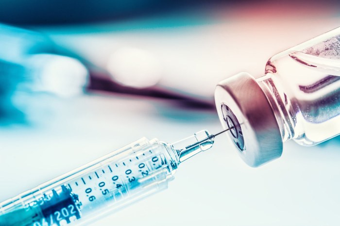 COVID-19 vaccine | Close-up medical syringe with a vaccine. | Alachua ... Vaccine stocks muted wall street takes wait watch approach after kennedys shake
